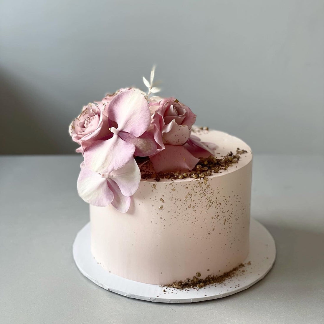 Fresh blooms on whipped cream - custom cake