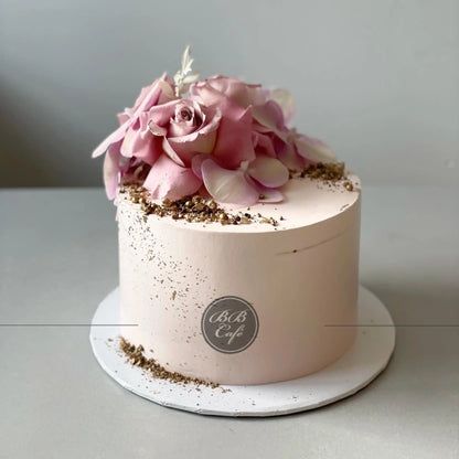 Fresh blooms on whipped cream - custom cake