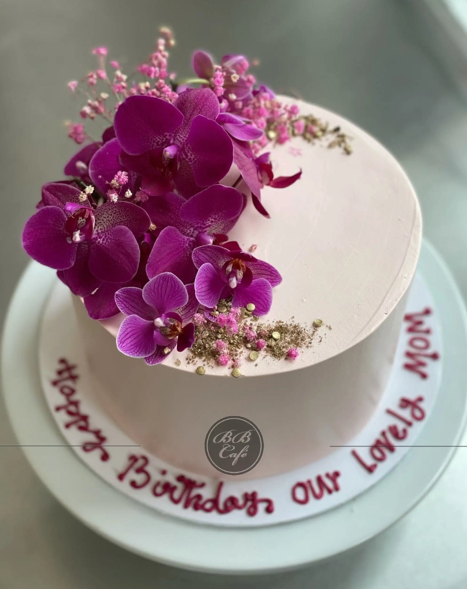 Fresh blooms on whipped cream - custom cake