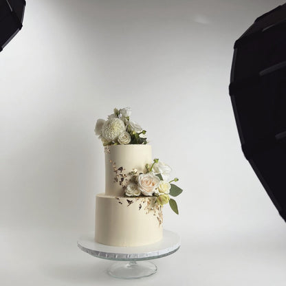 Fresh flowers on gilded buttercream - wedding cake
