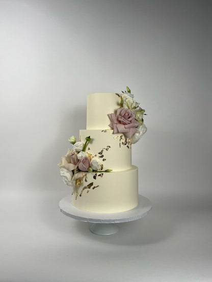 Fresh flowers on gilded buttercream - wedding cake