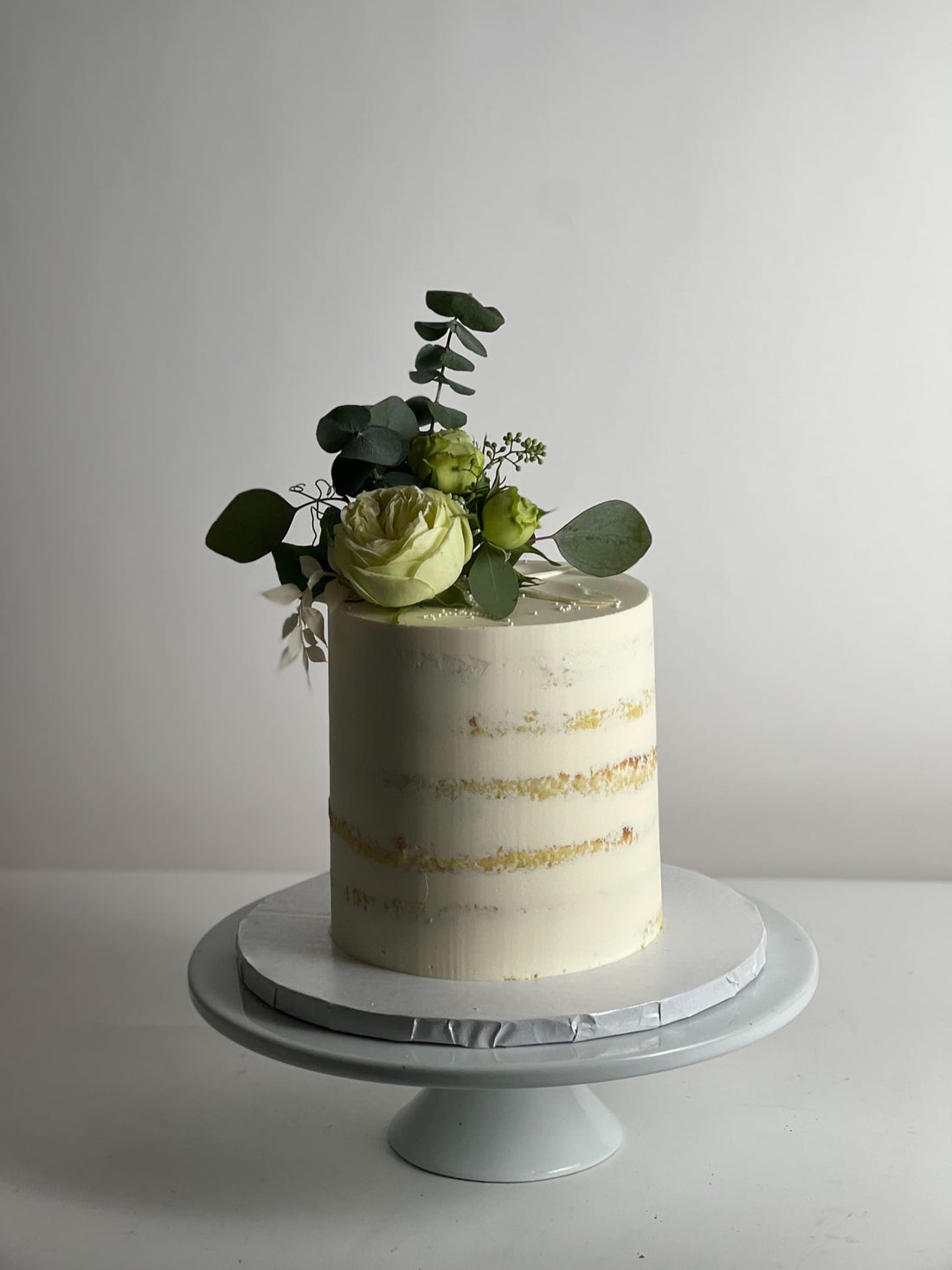 Fresh flowers on semi-naked buttercream - custom cake