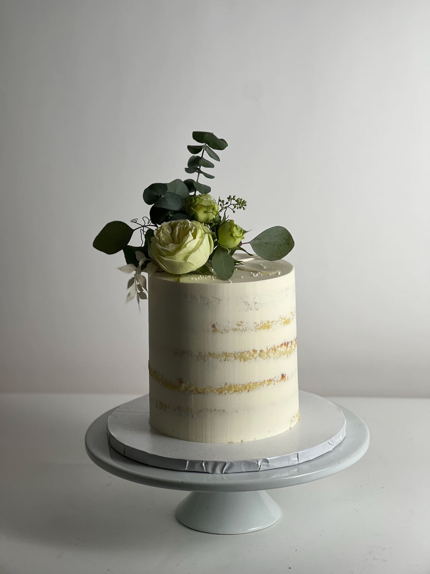 Fresh flowers on semi-naked buttercream - custom cake