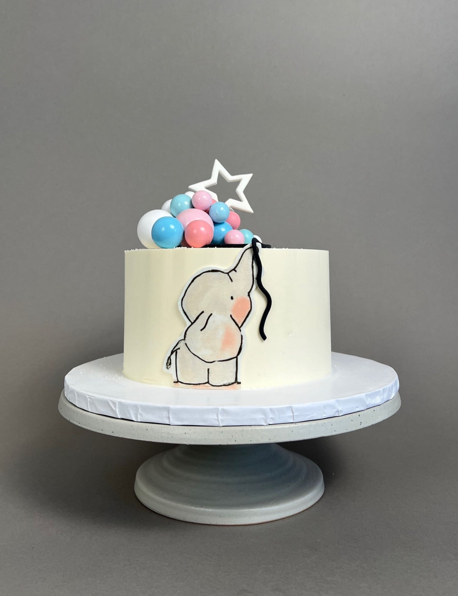 Gender reveal baby animal &amp; spheres - custom cake