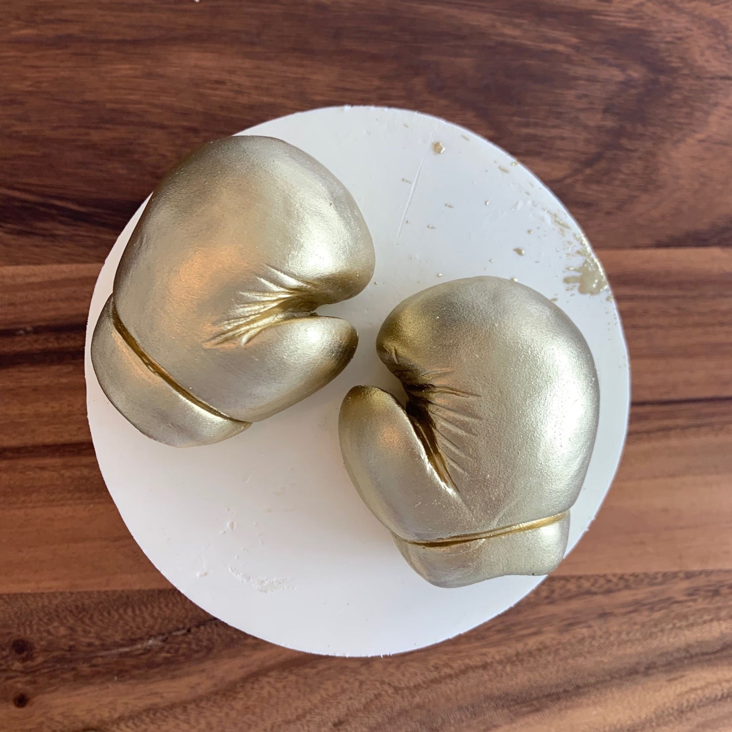 Golden boxing gloves on buttercream - custom cake
