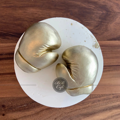 Golden boxing gloves on buttercream - custom cake