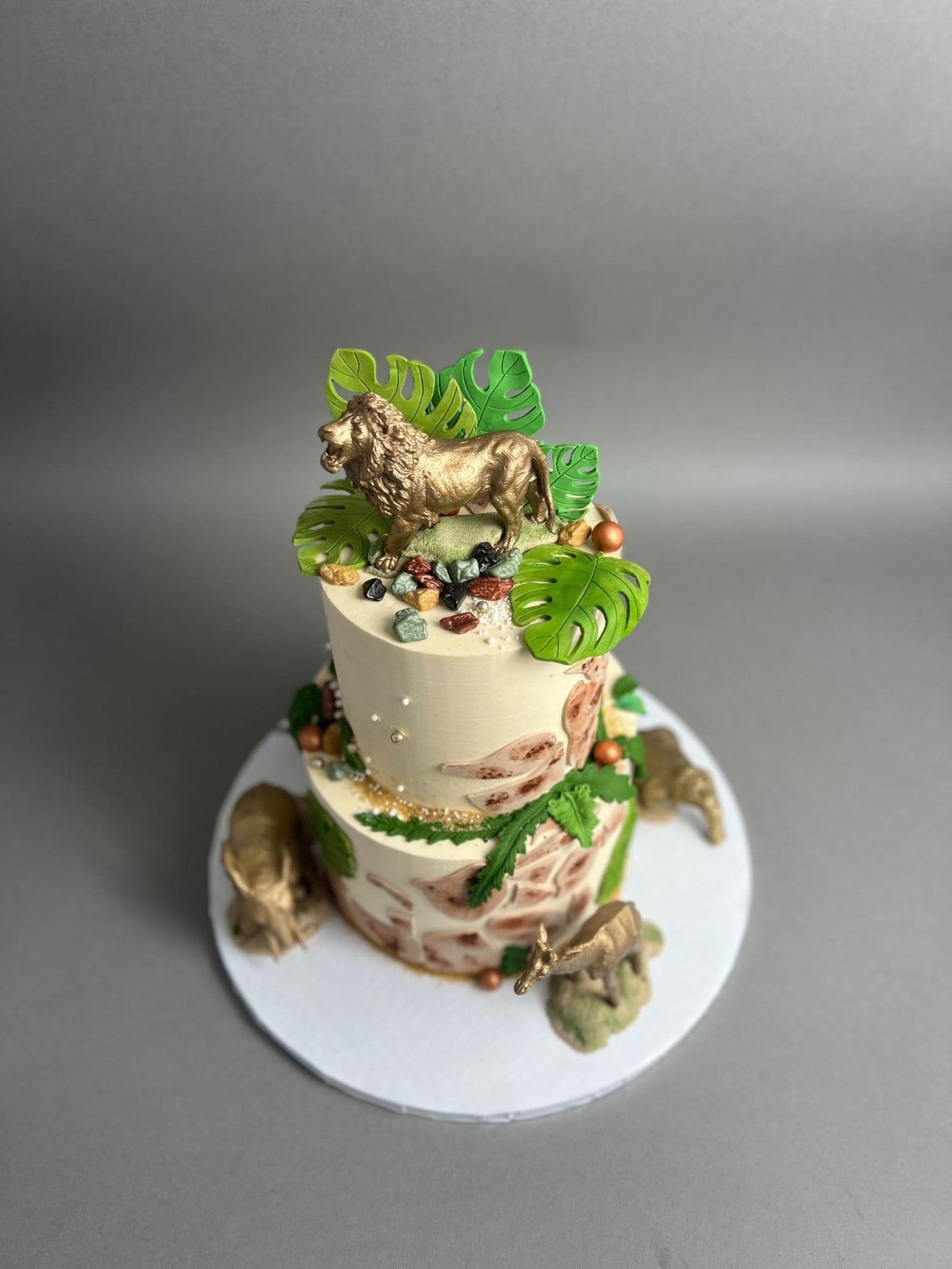 Golden safari animals on buttercream - custom cake
