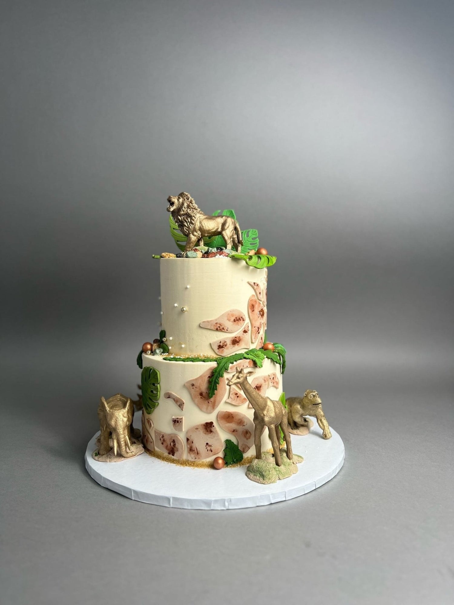 Golden safari animals on buttercream - custom cake