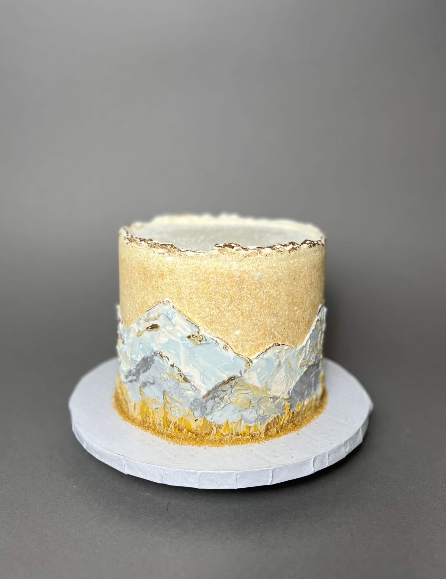 Hand painted mountain scenery on buttercream - custom cake