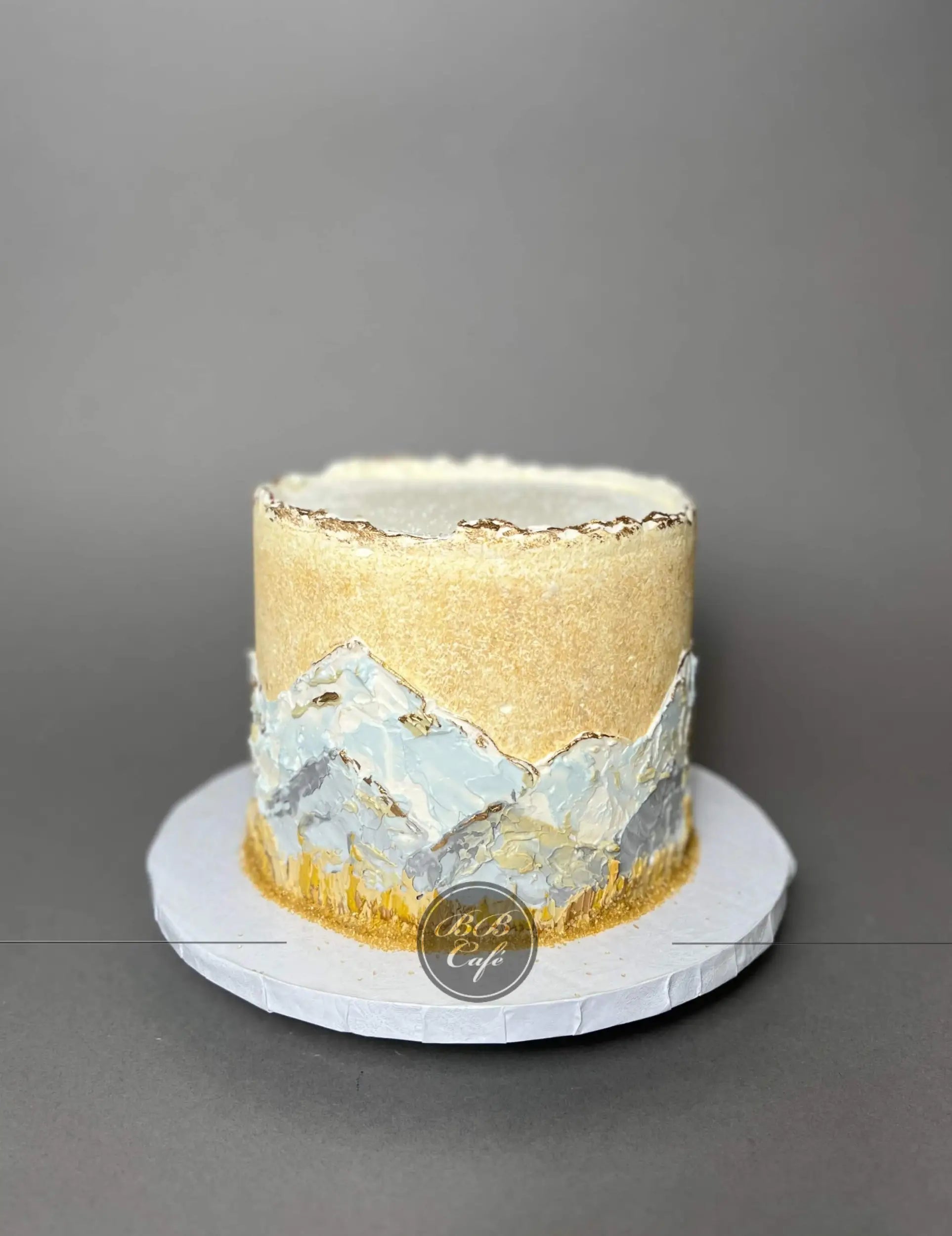 Hand painted mountain scenery on buttercream - custom cake