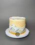 Hand painted mountain scenery on buttercream - custom cake