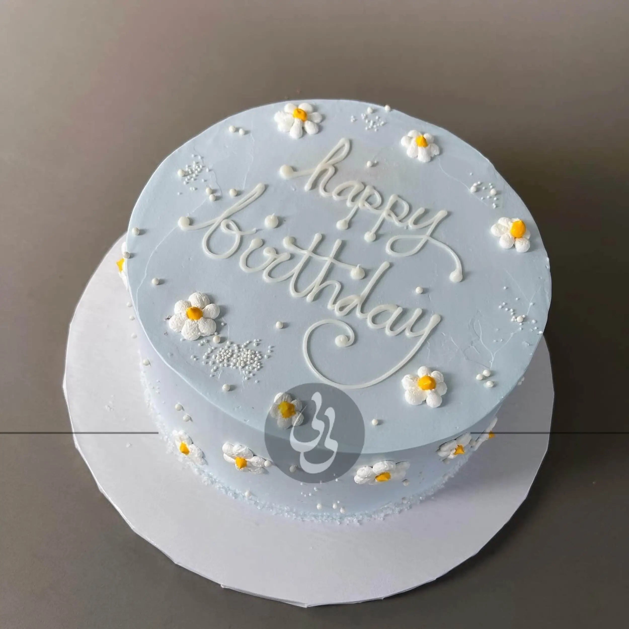 Hand piped daisies on whipped cream - custom cake