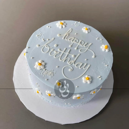 Hand piped daisies on whipped cream - custom cake