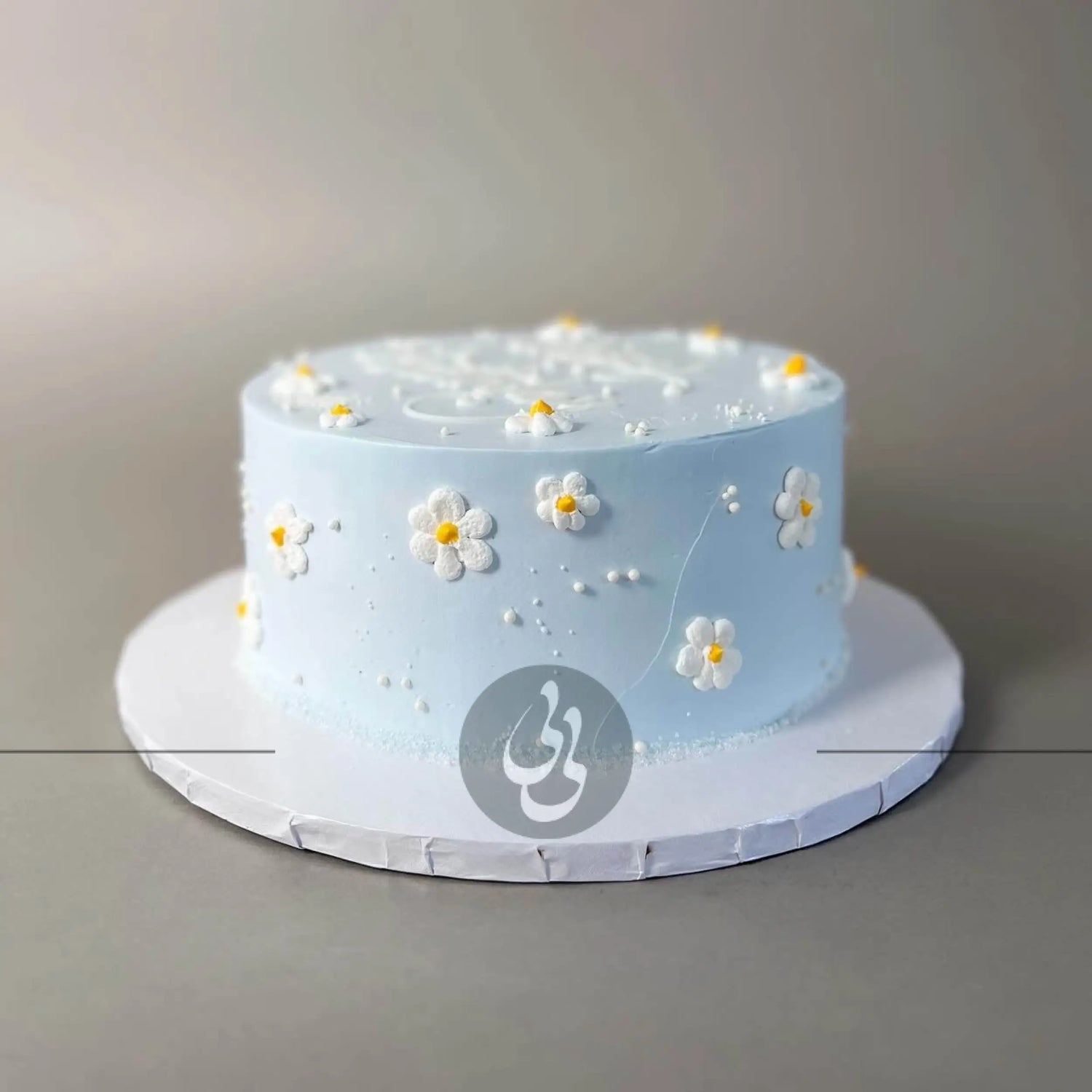 Hand piped daisies on whipped cream - custom cake