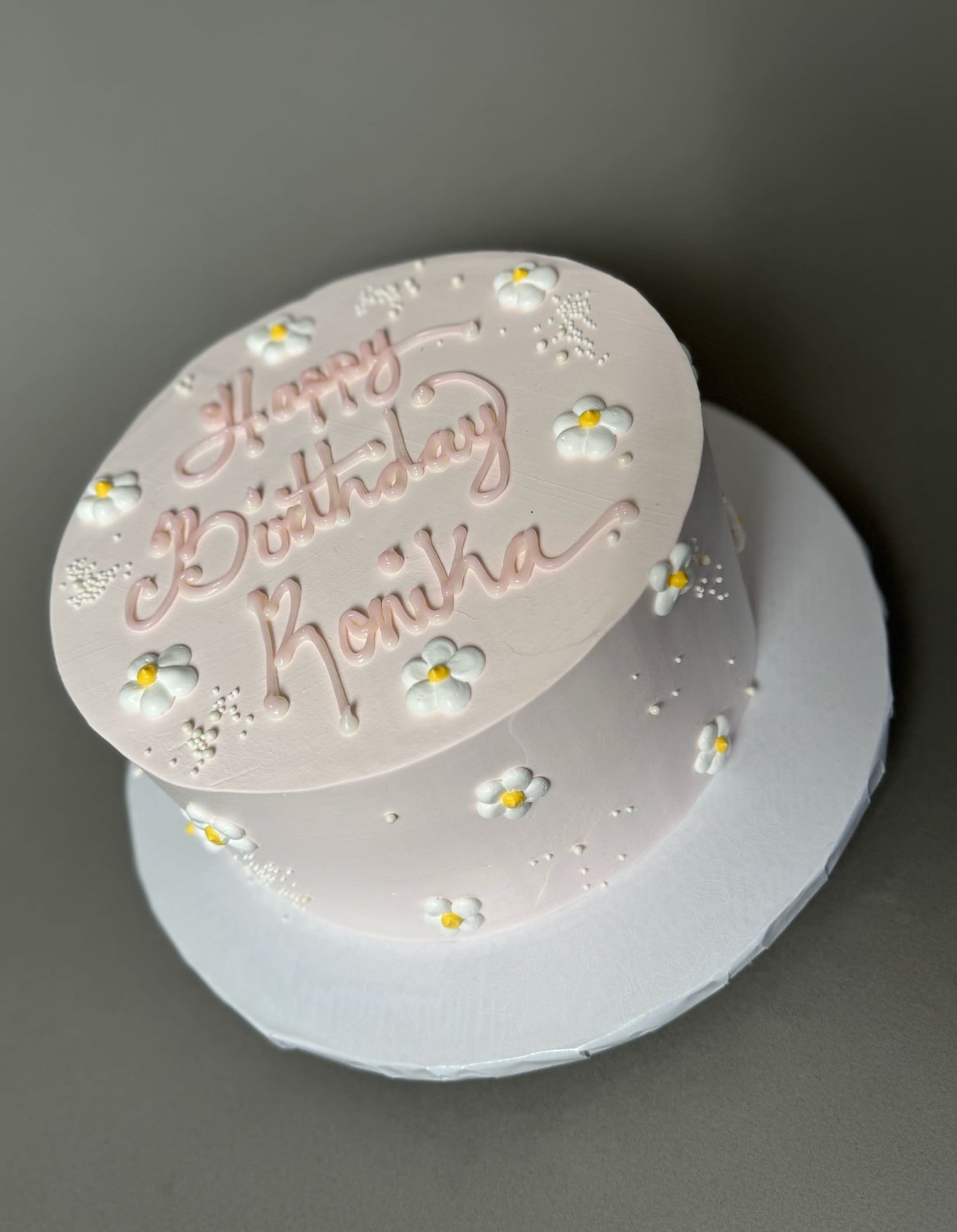 Hand piped daisies on whipped cream - custom cake