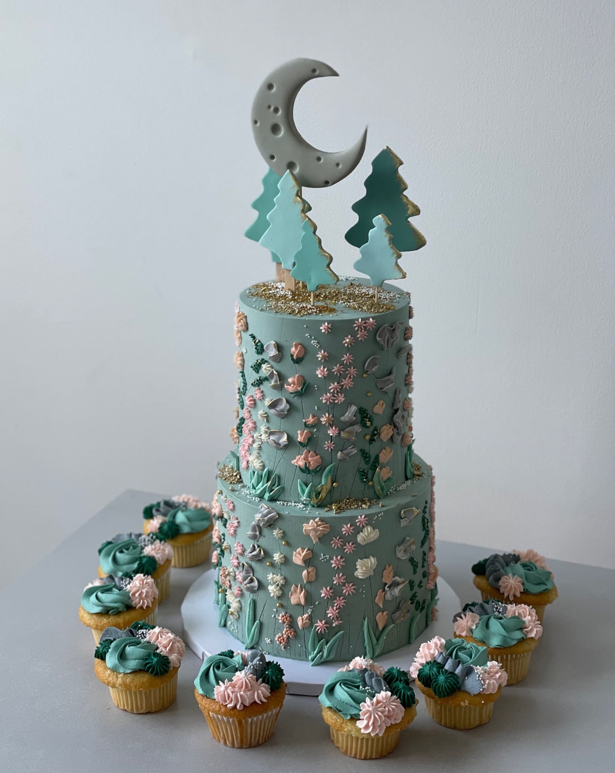 Hand piped meadow flowers &amp; moon - custom cake