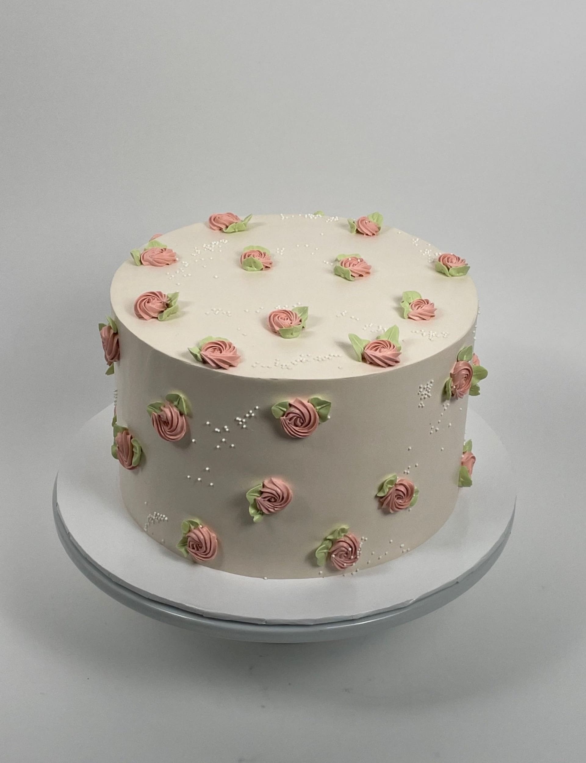 Hand piped mini rosettes on whipped cream - custom cake