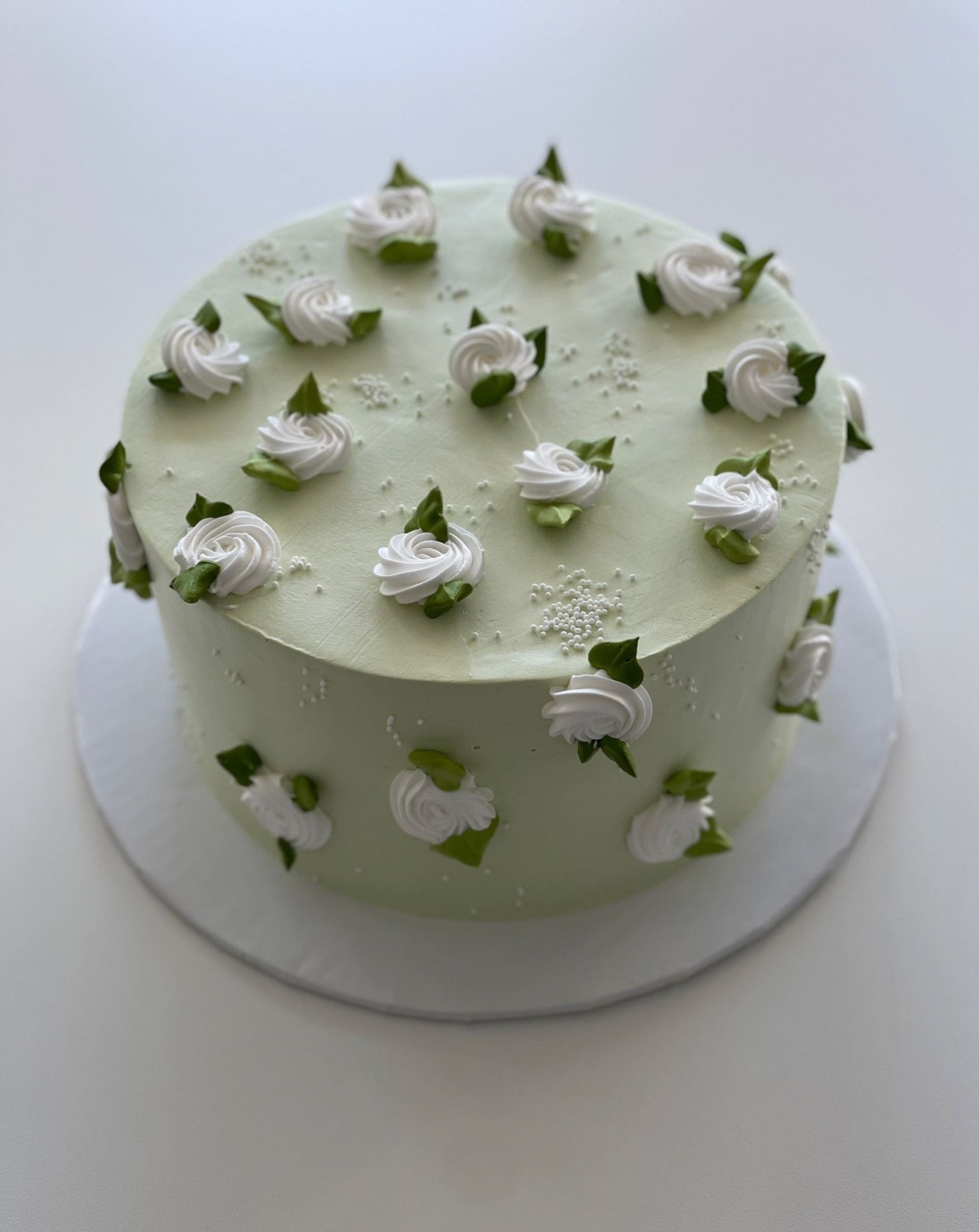 Hand piped mini rosettes on whipped cream - custom cake