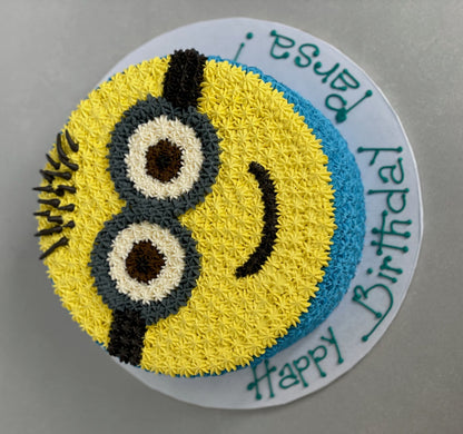 Hand piped minion face on buttercream - custom cake