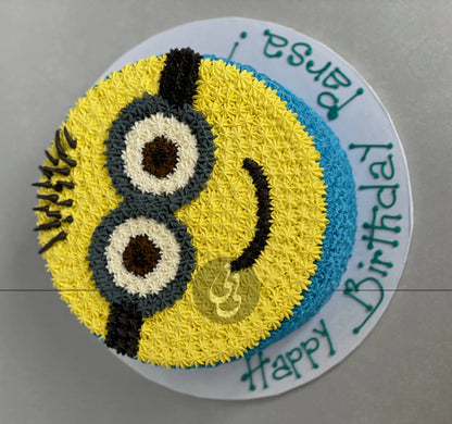 Hand piped minion face on buttercream - custom cake