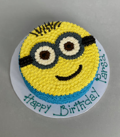 Hand piped minion face on buttercream - custom cake