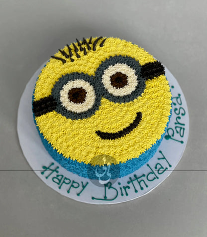 Hand piped minion face on buttercream - custom cake