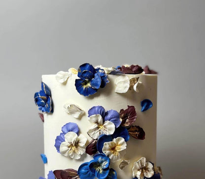 Hand piped pansy flowers on buttercream - custom cake