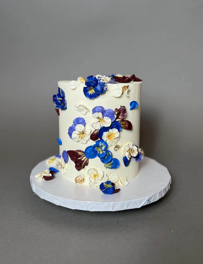 Hand piped pansy flowers on buttercream - custom cake