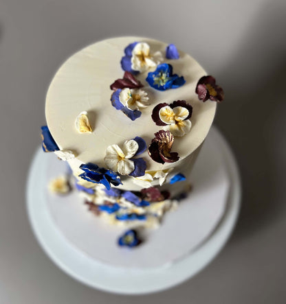 Hand piped pansy flowers on buttercream - custom cake