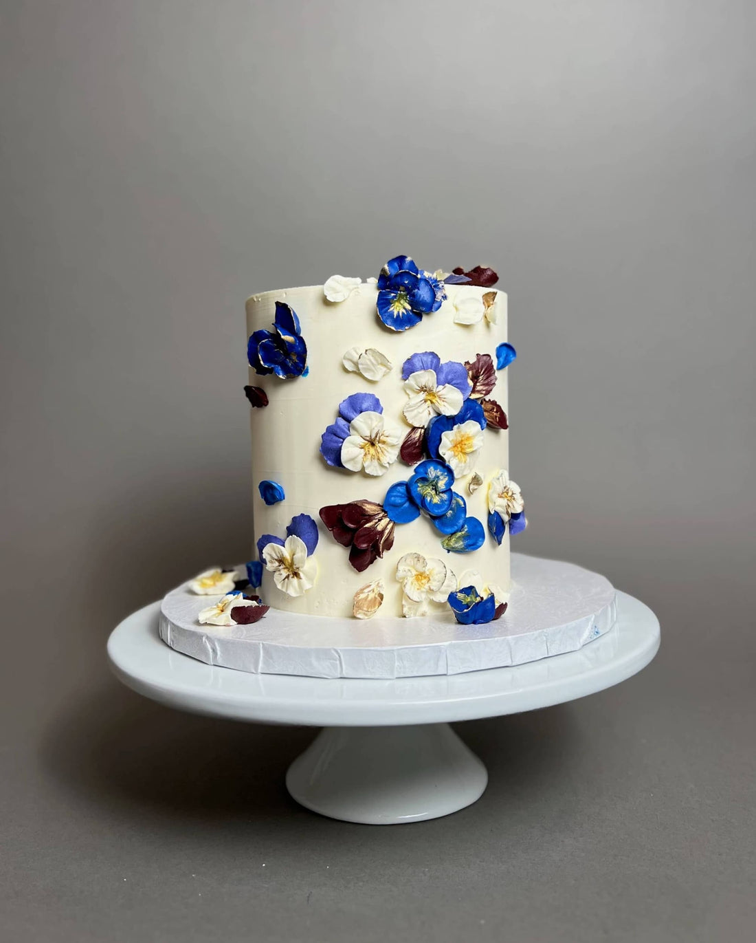 Hand piped pansy flowers on buttercream - custom cake