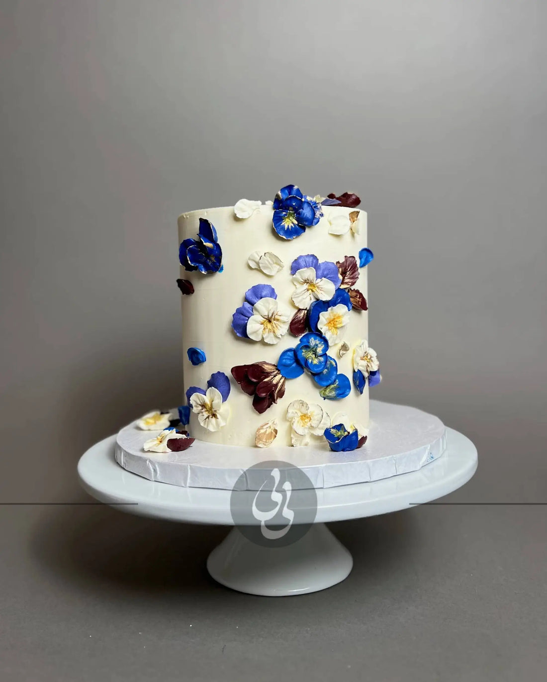 Hand piped pansy flowers on buttercream - custom cake