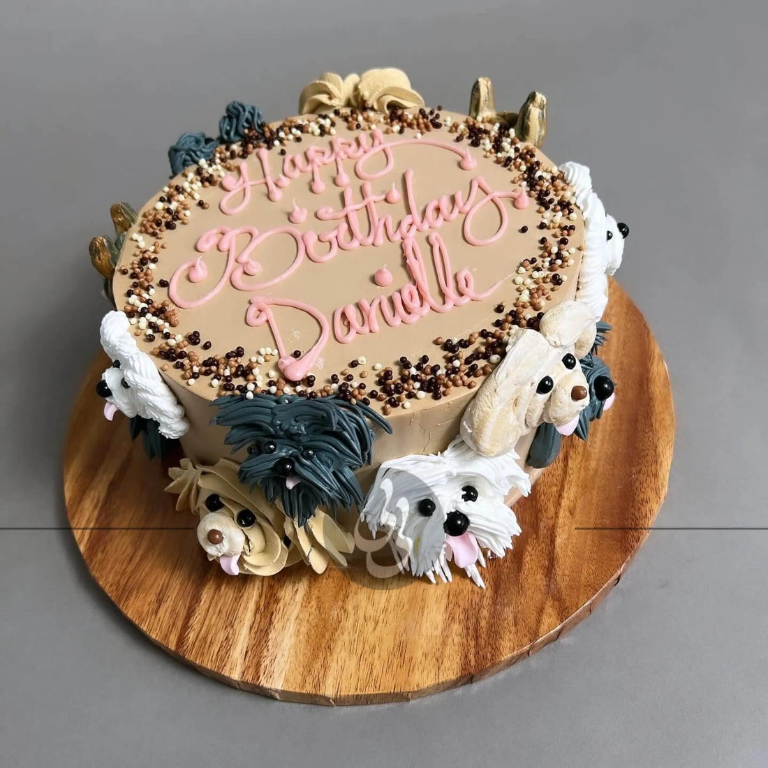 Hand piped puppy party on whipped cream - custom cake