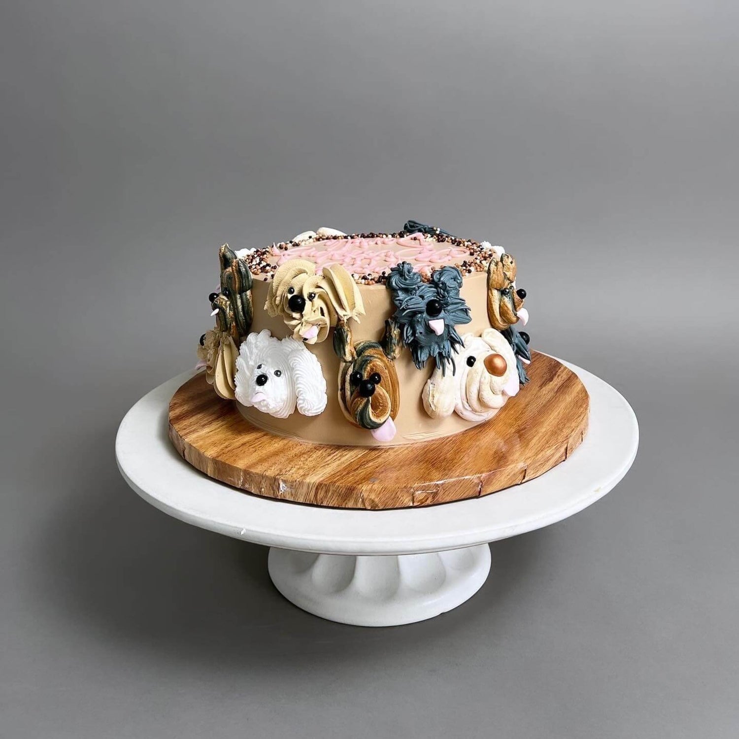 Hand piped puppy party on whipped cream - custom cake