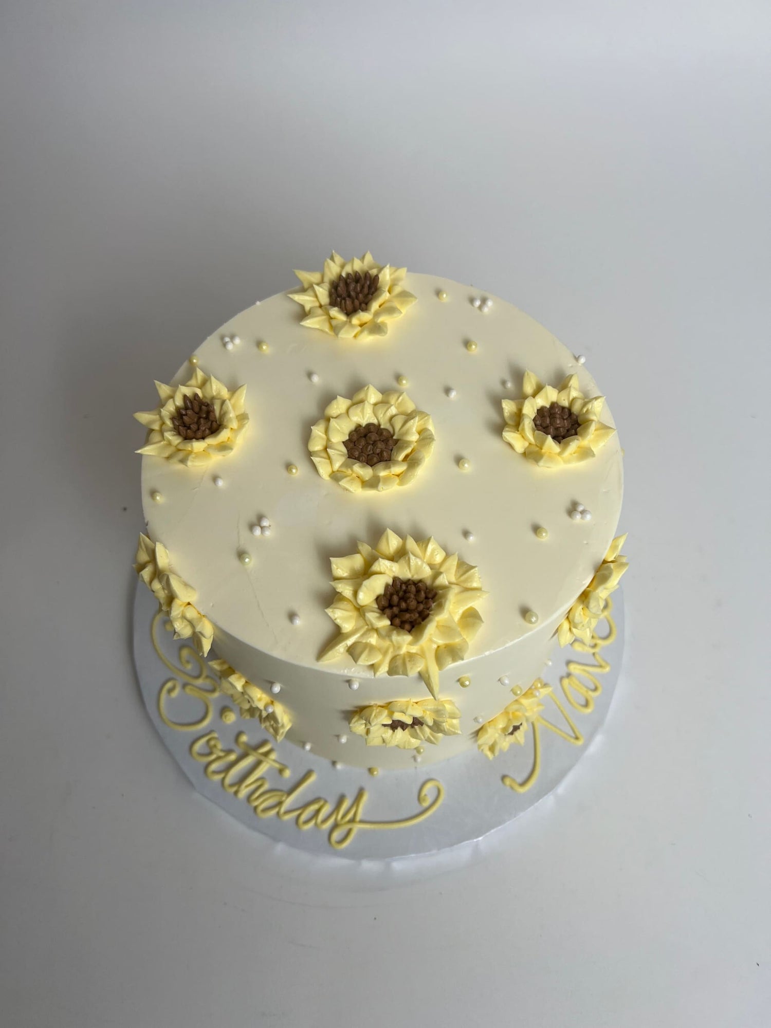 Hand piped sunflowers on buttercream - custom cake