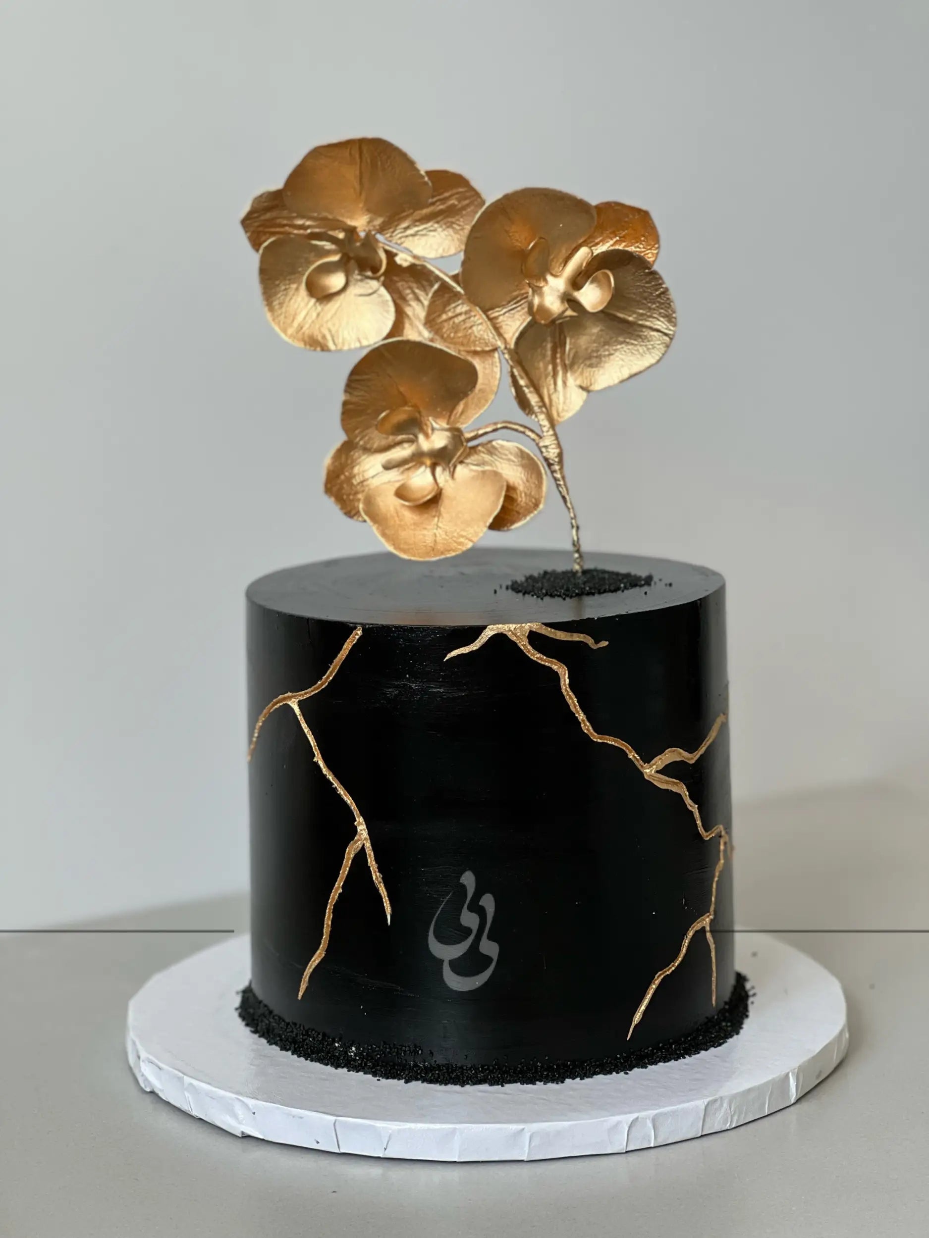 Kintsugi and fresh orchid flowers on buttercream - custom cake