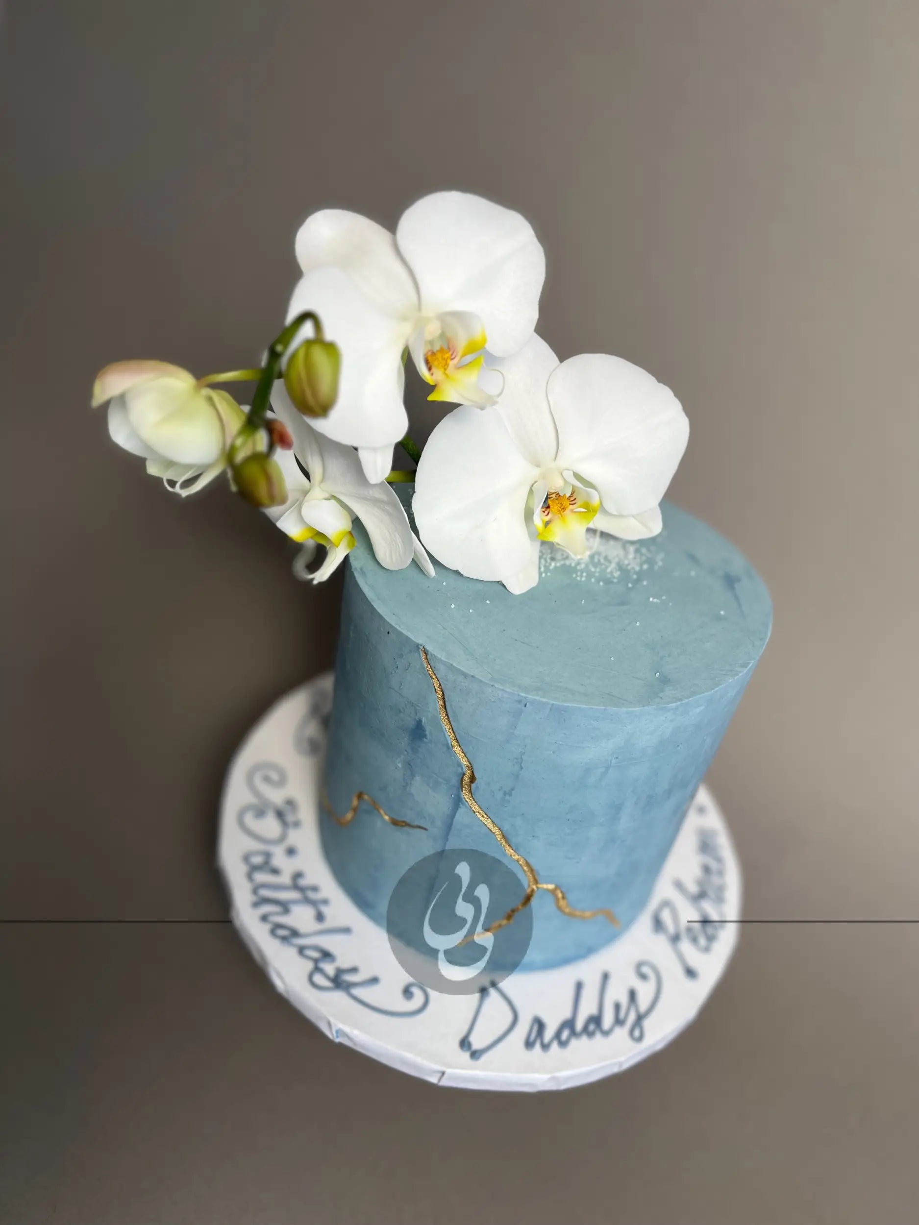 Kintsugi and fresh orchid flowers on buttercream - custom cake