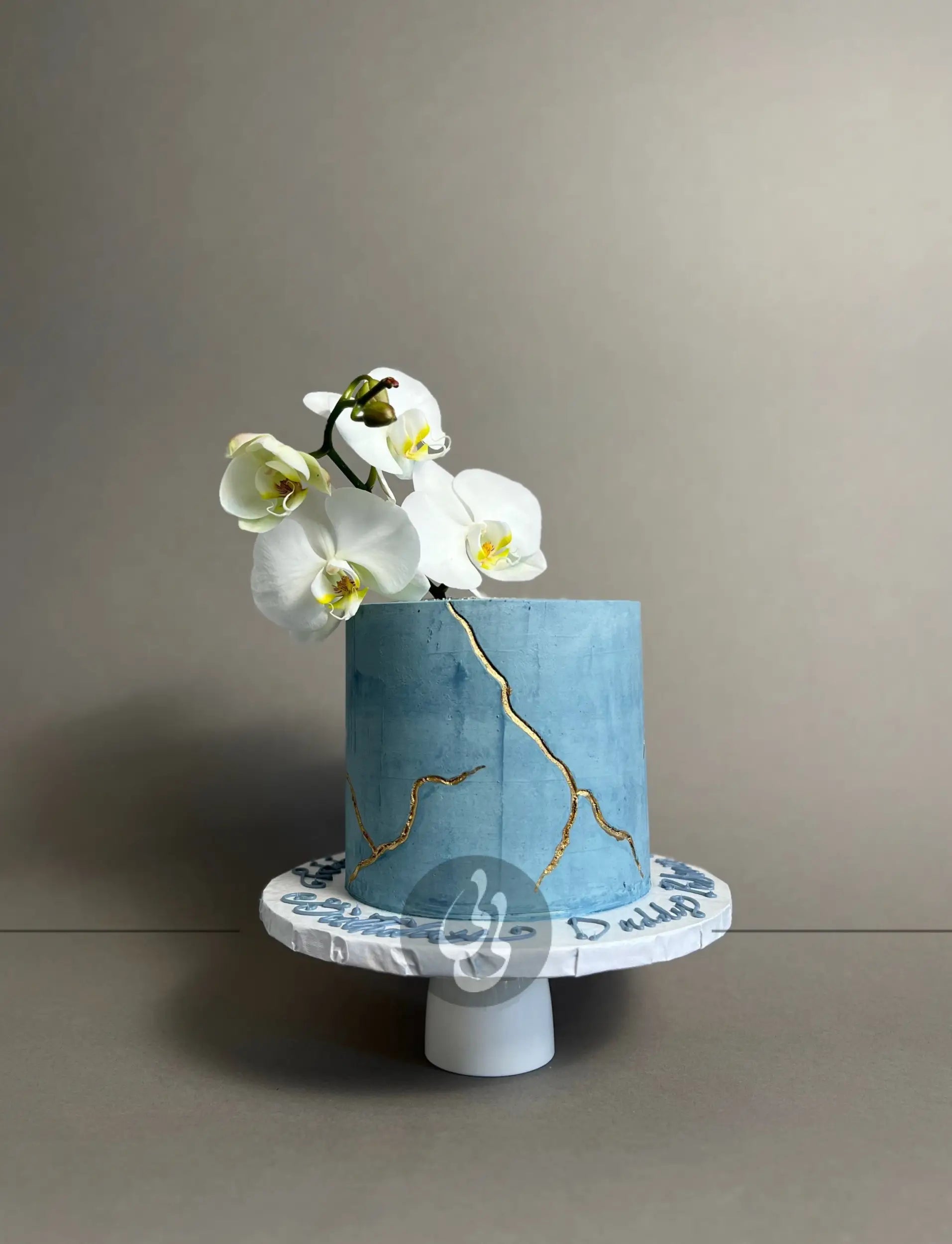 Kintsugi and fresh orchid flowers on buttercream - custom cake