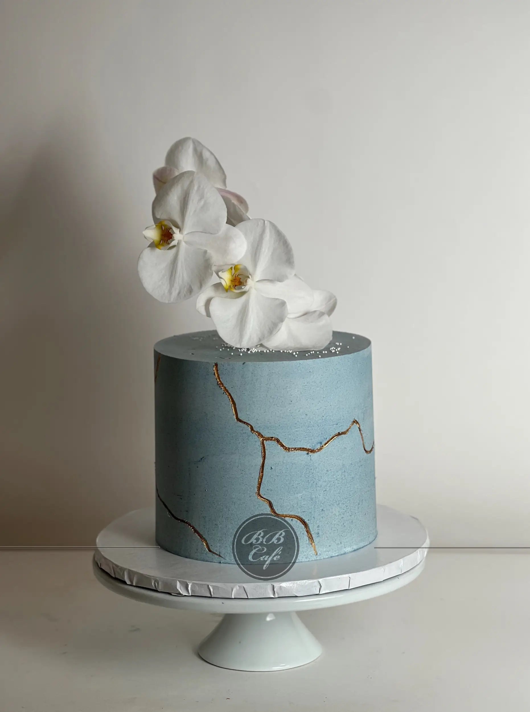 Kintsugi and sugar orchid flowers on buttercream - custom cake