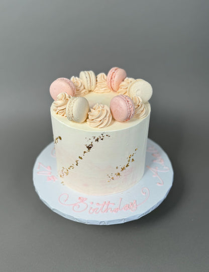 Macarons &amp; gold foil on marble buttercream - custom cake