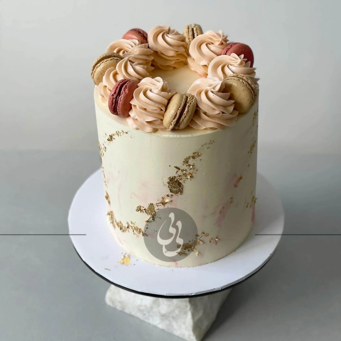 Macarons & gold foil on marble buttercream - custom cake