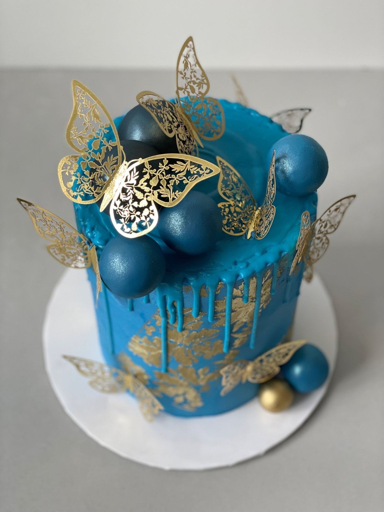 Metallic butterflies &amp; drips on buttercream - custom cake