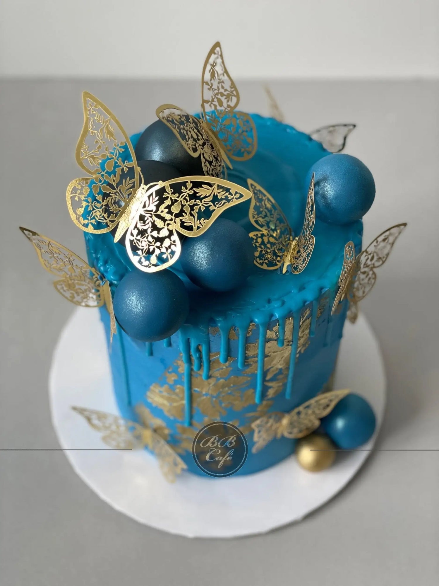 Metallic butterflies &amp; drips on buttercream - custom cake