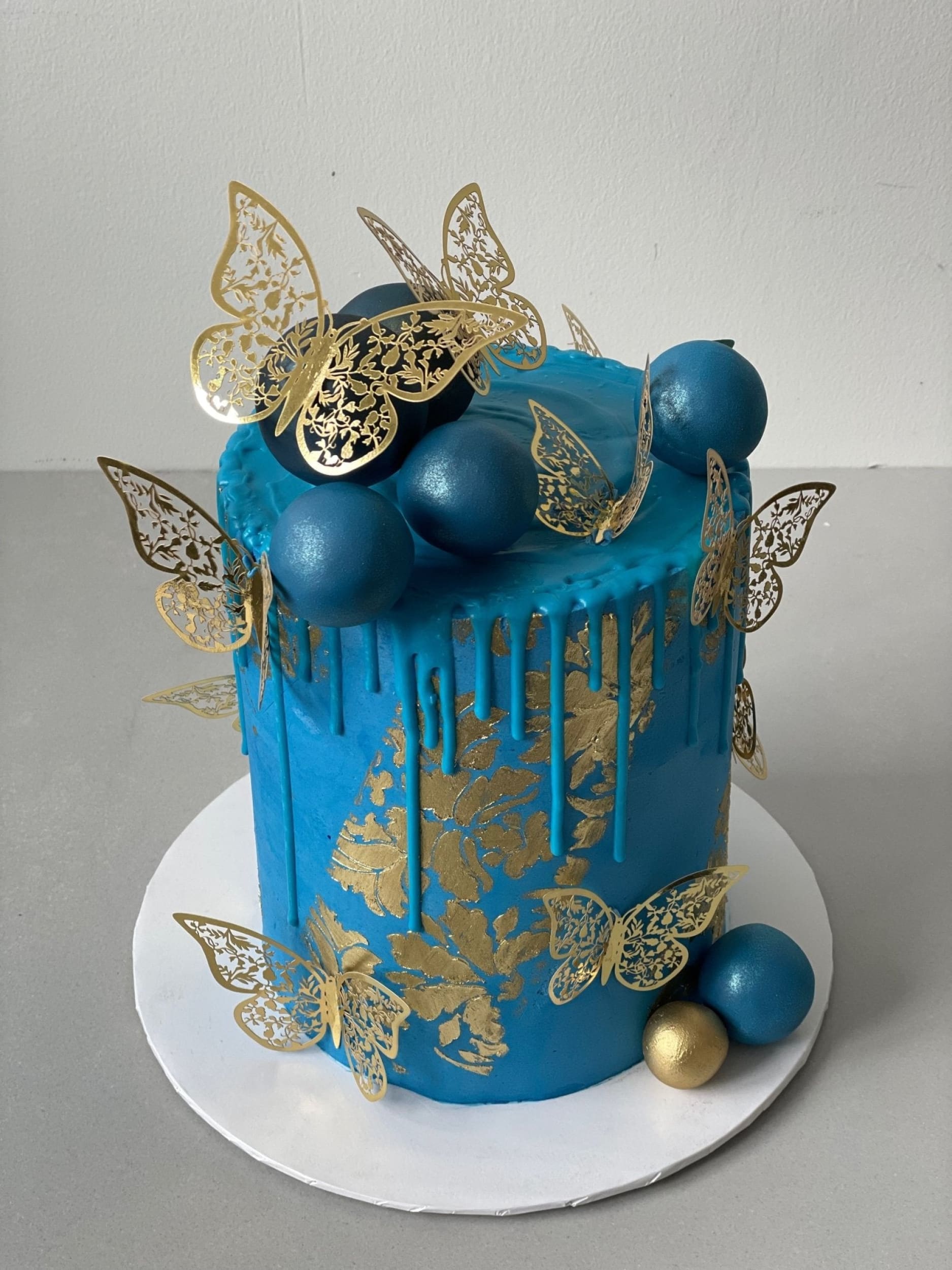 Metallic butterflies &amp; drips on buttercream - custom cake