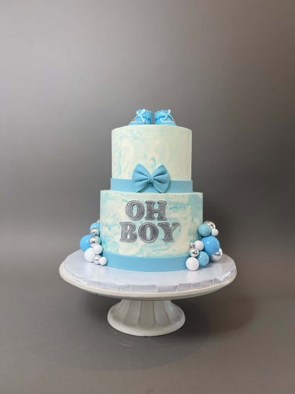 Oh baby booties on marble buttercream - custom cake
