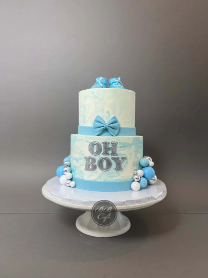 Oh baby booties on marble buttercream - custom cake