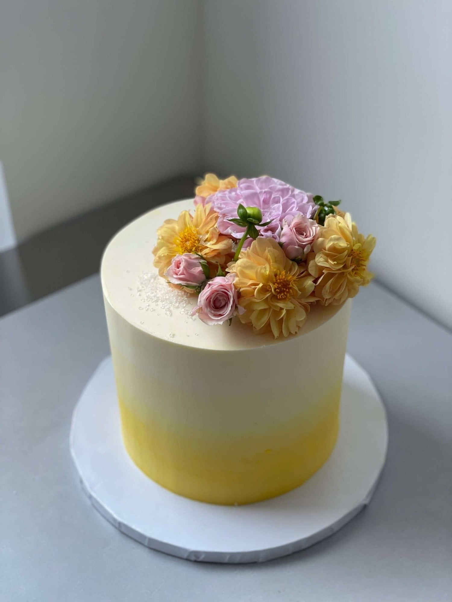 Ombre with fresh flowers on buttercream - custom cake