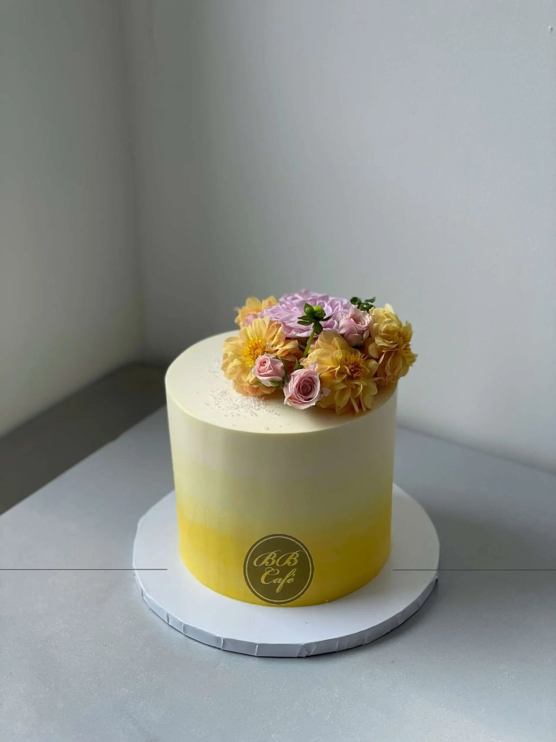 Ombre with fresh flowers on buttercream - custom cake