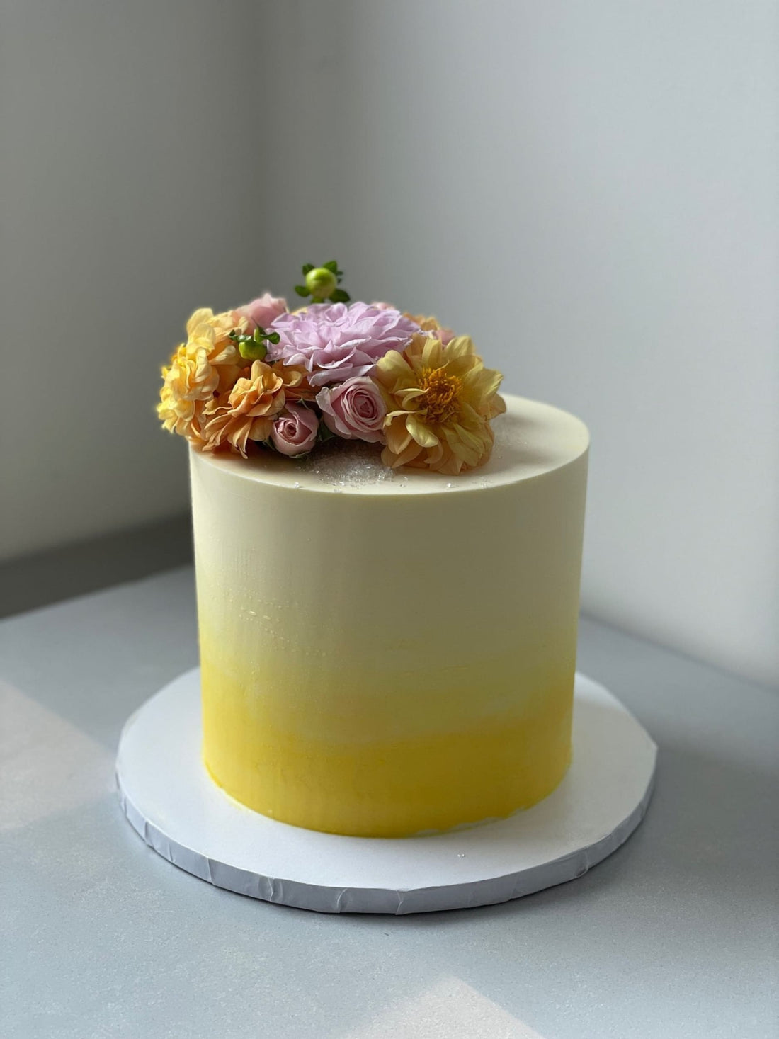 Ombre with fresh flowers on buttercream - custom cake