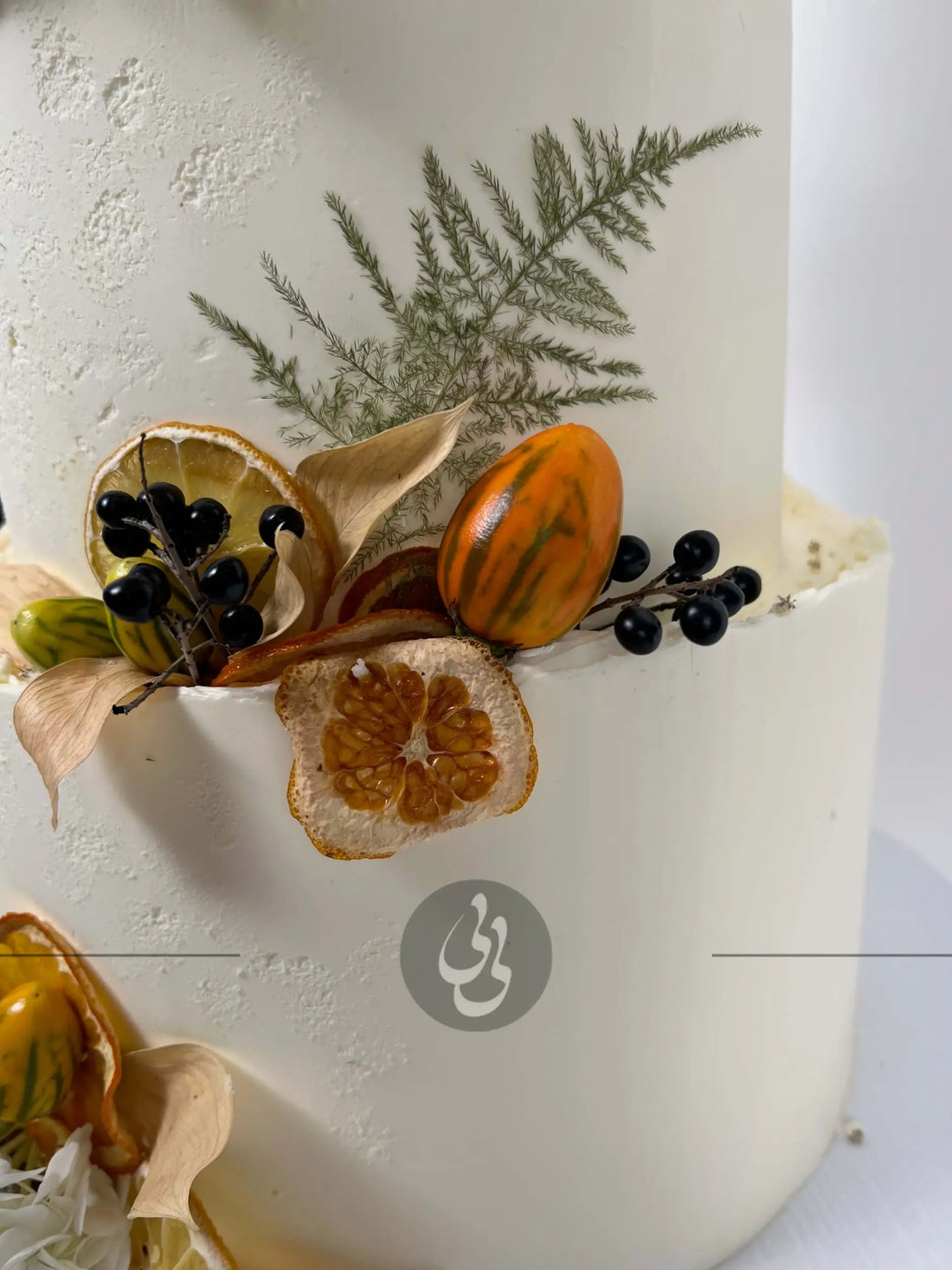 Seasonal fruits & fresh flowers on deckled edge buttercream - wedding cake