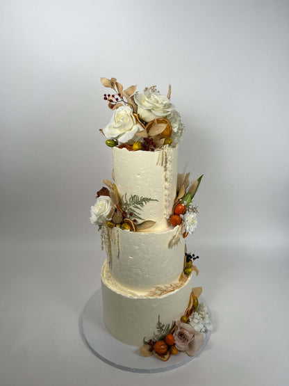 Seasonal fruits &amp; fresh flowers on deckled edge buttercream - wedding cake